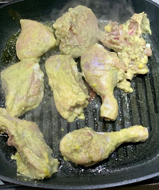 Step 1.1: Place the marinated chicken on the hot grill pan and sear it, flipping occasionally, until it turns slightly golden brown from both sides