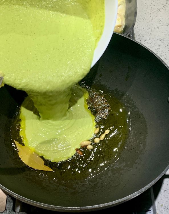 Step 1.1: Add the reserved yogurt-green paste mixture to the wok and mix well
