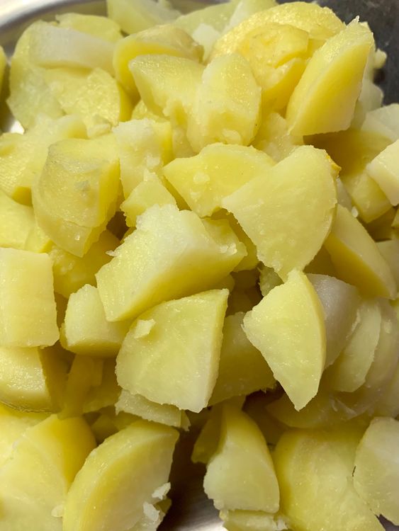 Step 1.1: Wash, boil and peel potatoes, cut them into small pieces, and set aside