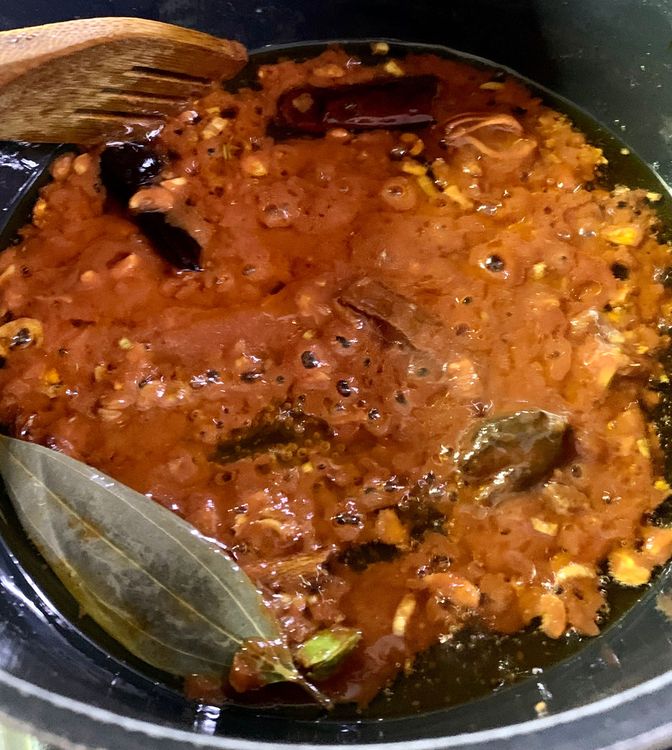 Step 1.1: Add the ground tomatoes and green chilli and cook for 3-4 minutes