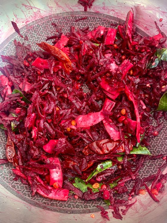 Step 1.1: Add the grated beetroot, sliced coconut, and salt