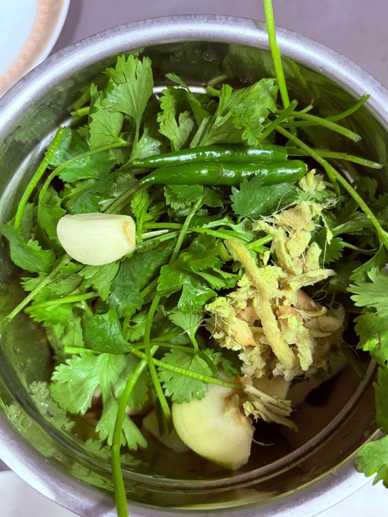 Step 1.1: Add the chopped guavas, coriander leaves, green chillies, ginger, garlic, and a little water to a blender
