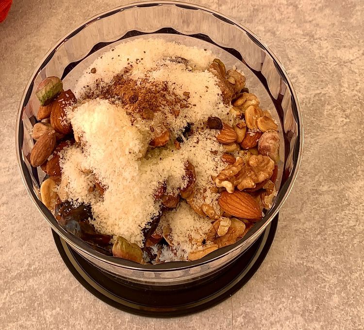 Step 1.1: In a food processor, add the soft dates, toasted nuts, desiccated coconut, olive oil, cinnamon and a pinch of salt
