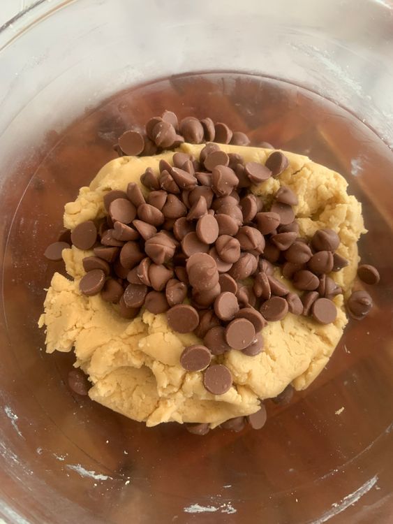 Step 1.1: Stir in the chocolate chips, ensuring they are evenly distributed by gently kneading the dough