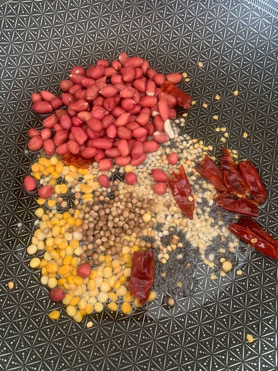 Step 1.1: Add the dry red chillies, coriander seeds, chana dal, urad dal, and peanuts