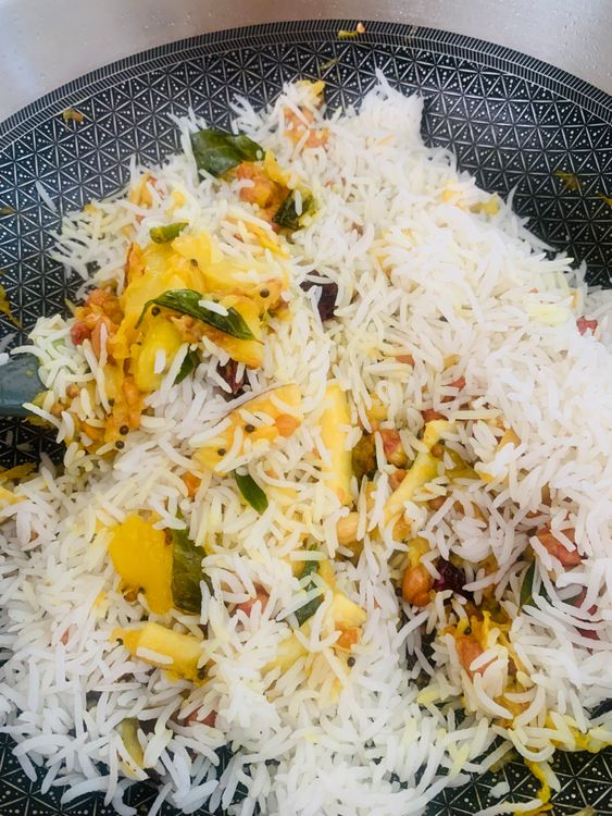 Step 1.1: Add the cooked rice to the pan along with salt