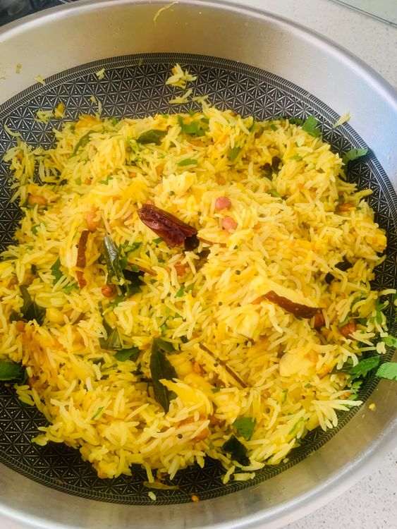 Step 1.2: Add the cooked rice to the pan along with salt
