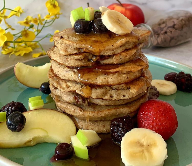 Step 1.2: Serve the pancakes with maple syrup, sliced banana, chopped apples and strawberries on top