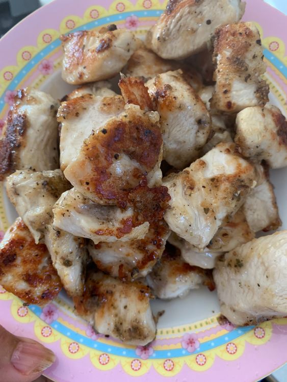Step 1.1: Add the marinated chicken pieces to the skillet, making sure they are spaced apart