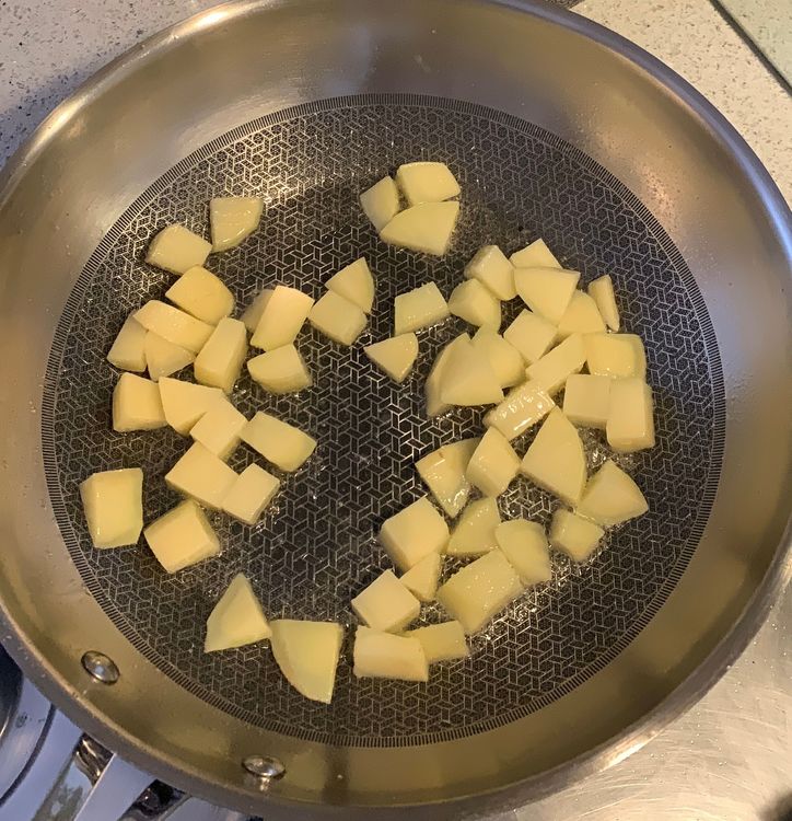 Step 1.1: Heat 2 tbsp of oil in a pan over medium heat