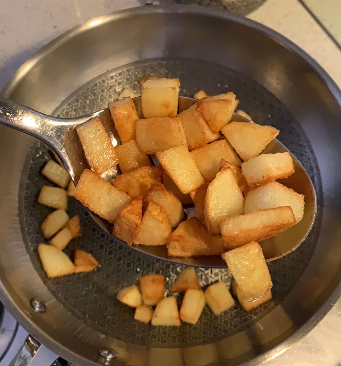 Step 1.2: Heat 2 tbsp of oil in a pan over medium heat