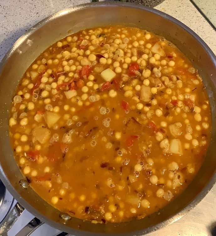 Step 1.2: Add the cooked peas and fried potatoes to the pan, and mix everything together