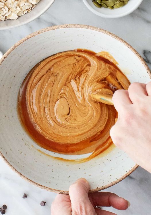 Step 1.1: Stir together the wet ingredients – the cashew or peanut butter, honey, vanilla extract, and salt