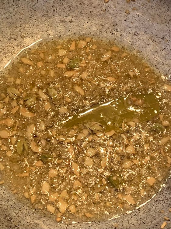 Step 1.1: Add the chopped ginger and garlic, and cook until golden
