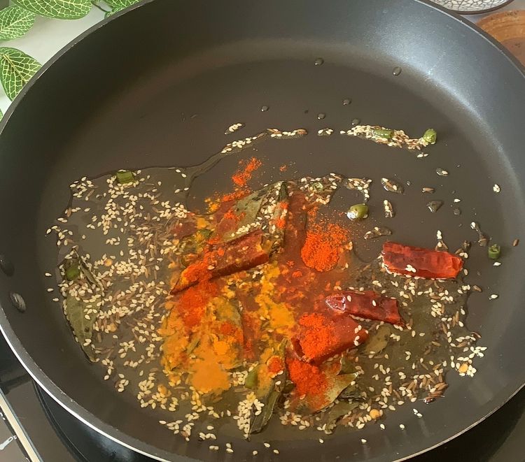 Step 1.1: Add in turmeric powder and red chilli powder
