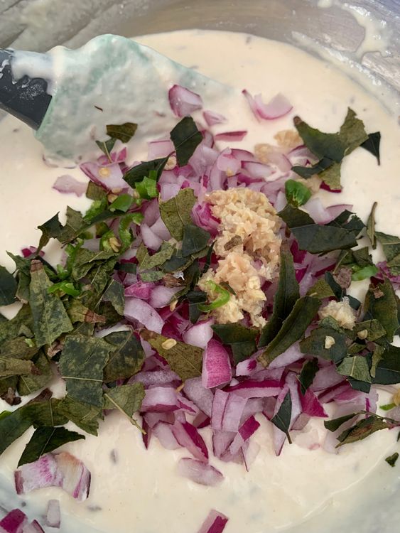 Step 1.1: Add chopped onion, green chillies, ginger, curry leaves and baking soda to the batter