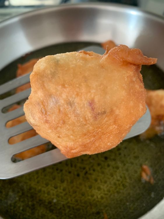 Step 1.1: Once cooked, remove the bondas from the oil using a slotted spoon and place them on a paper towel-lined plate to drain excess oil