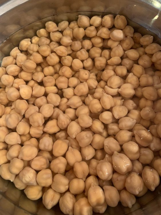 Step 1.1: Cook the soaked chickpeas in a pressure cooker with water and a teaspoon of salt or use an instant cooker until they become soft and tender
