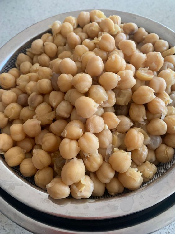 Step 1.2: Cook the soaked chickpeas in a pressure cooker with water and a teaspoon of salt or use an instant cooker until they become soft and tender