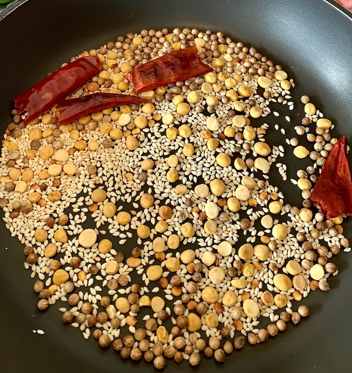 Step 1.2: Dry roast channa dal, coriander seeds, sesame seeds and dry red chillies in a pan over medium heat until aroma arises