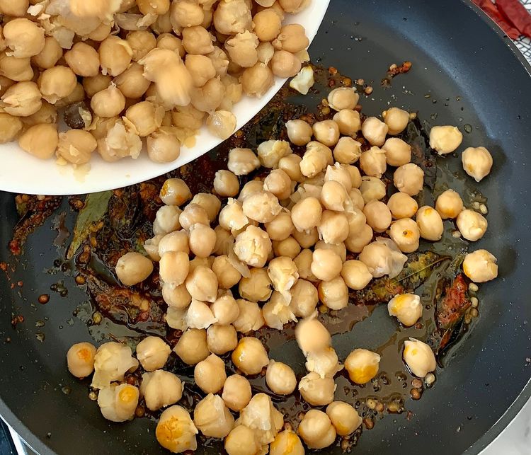 Step 1.1: Add boiled chickpeas to the pan