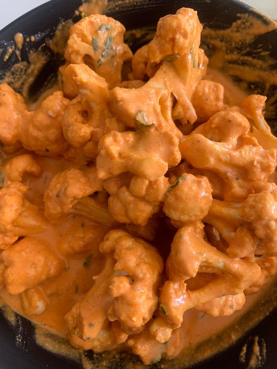 Step 3.1: Add the cauliflower florets to the batter, mixing well to ensure they are evenly coated