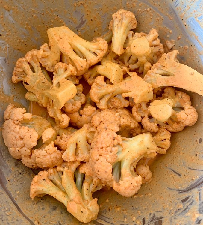 Step 2.1: Add cauliflower florets to the batter, ensuring they are well coated