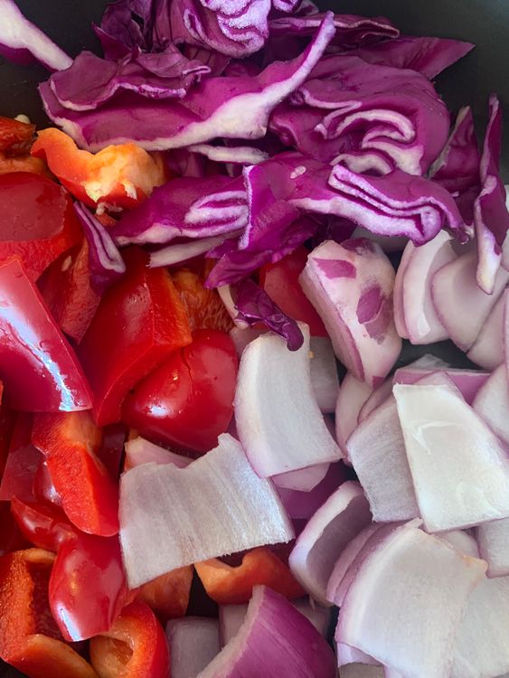 Step 4.1: Add cubed onions, red capsicum, and diced cabbage