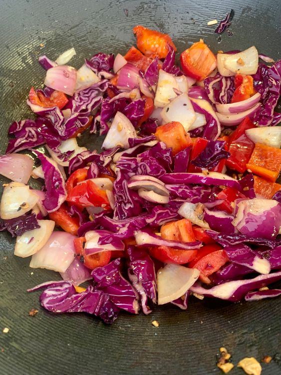 Step 4.2: Add cubed onions, red capsicum, and diced cabbage