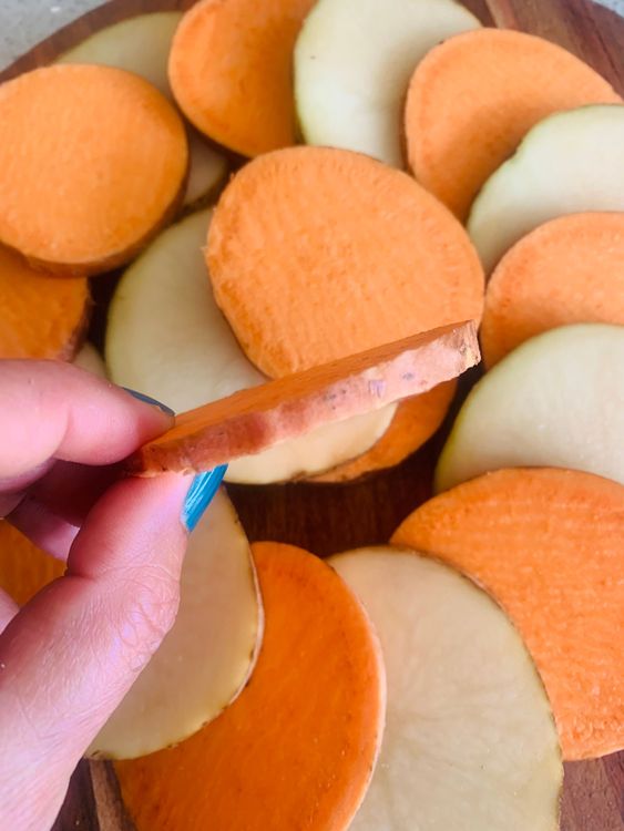 Step 1.2: Wash the potatoes and sweet potato thoroughly, then slice them into 1/4-inch thick rounds