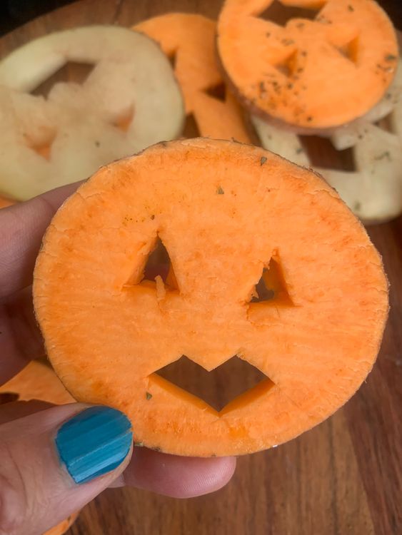 Step 1.1: Using a small knife or toothpick, carefully carve out eyes and mouths on each round to create spooky faces