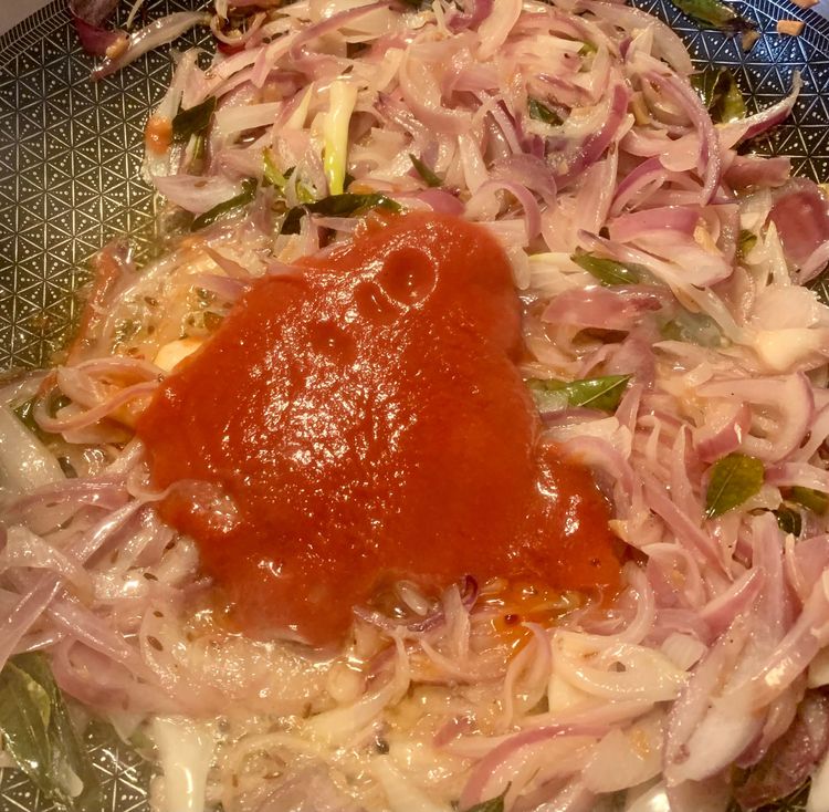 Step 1.1: Pour in the tomato puree and cook until the oil separates and releases to the surface