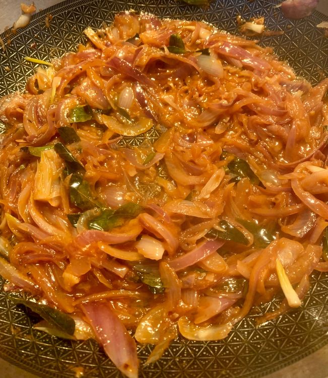 Step 1.2: Pour in the tomato puree and cook until the oil separates and releases to the surface