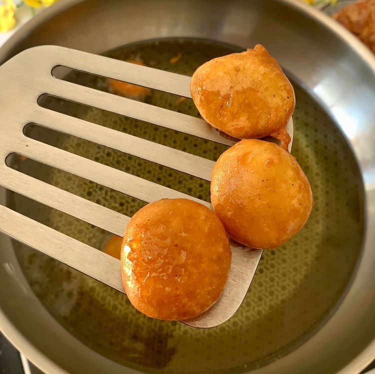 Step 1.1: Use a slotted spoon to remove the fritters and place them on a kitchen towel to absorb any excess oil