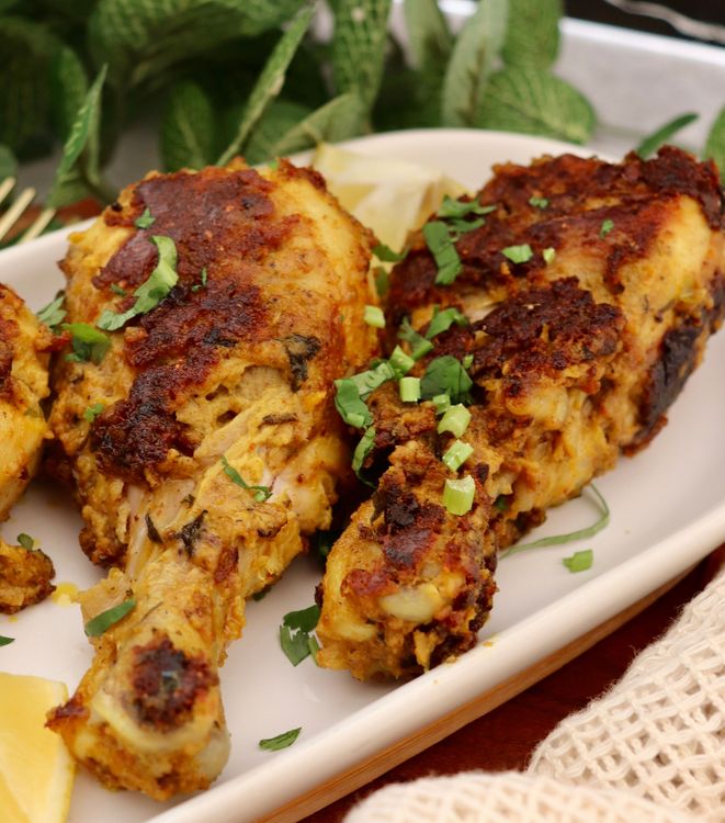 Step 3.1: Arrange the chicken on a serving platter, sprinkle with chaat masala, and garnish with fresh coriander