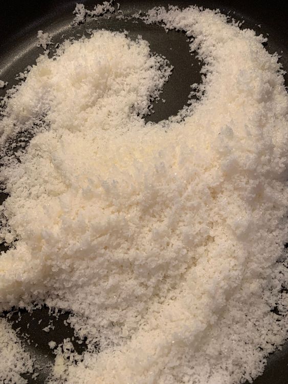 Step 1.1: Add desiccated coconut and sugar to the pan