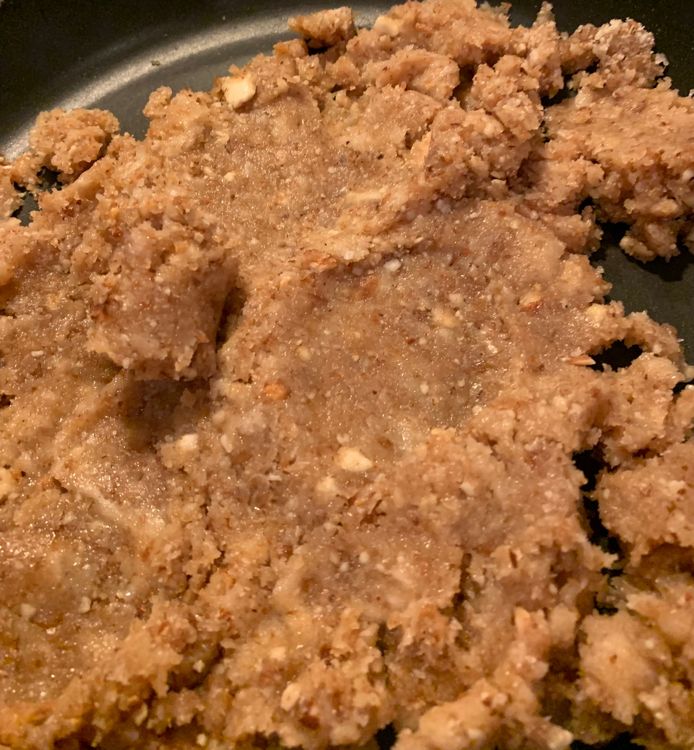 Step 1.2: Add the crushed bread mixture to the pan