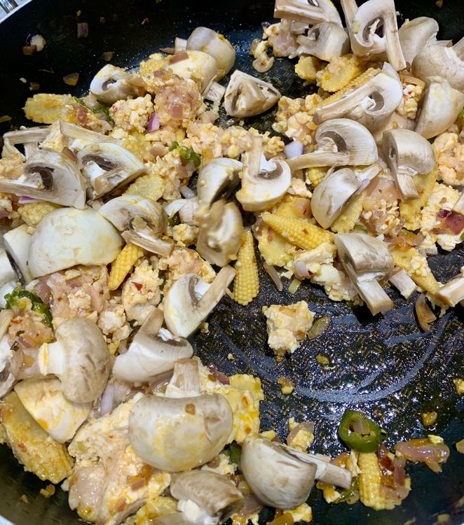 Step 3.1: Stir in the quartered mushrooms and cook for another minute, allowing them to soften