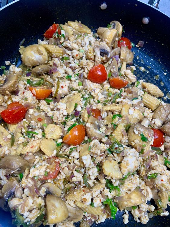 Step 3.1: Add the halved cherry tomatoes and cook for another minute, until they soften