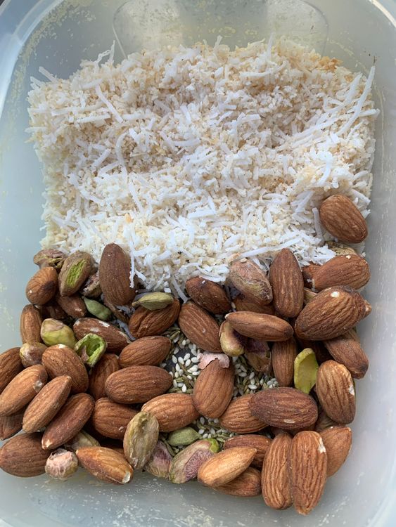 Step 1.1: Lightly dry roast the desiccated coconut, then grind it along with the roasted almonds and pistachios to a coarse consistency