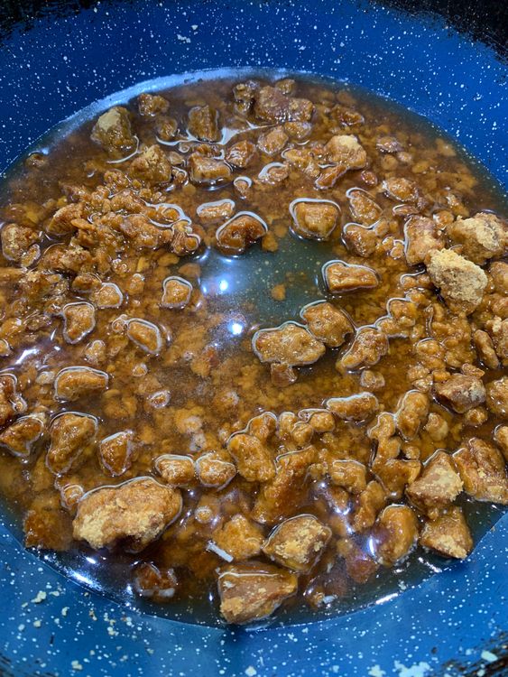 Step 2.1: In a separate pan, combine the jaggery and water