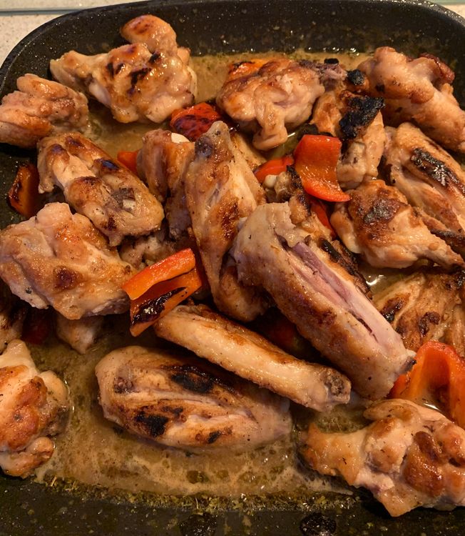 Step 1.1: Add the seared chicken wings into the saucepan and toss them to coat evenly