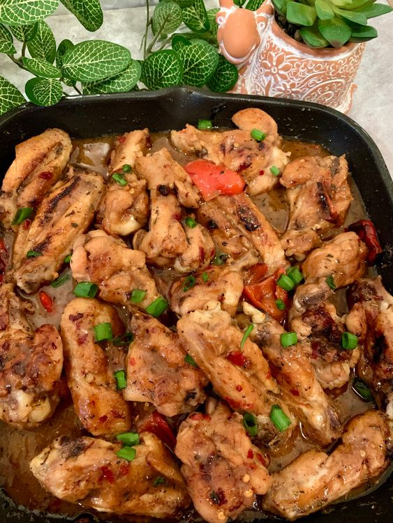 Step 1.1: Serve the chicken wings hot, garnished with chopped spring onions