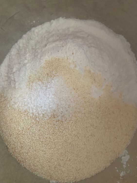 Step 1.1: In a wide bowl, combine rice powder, semolina and salt