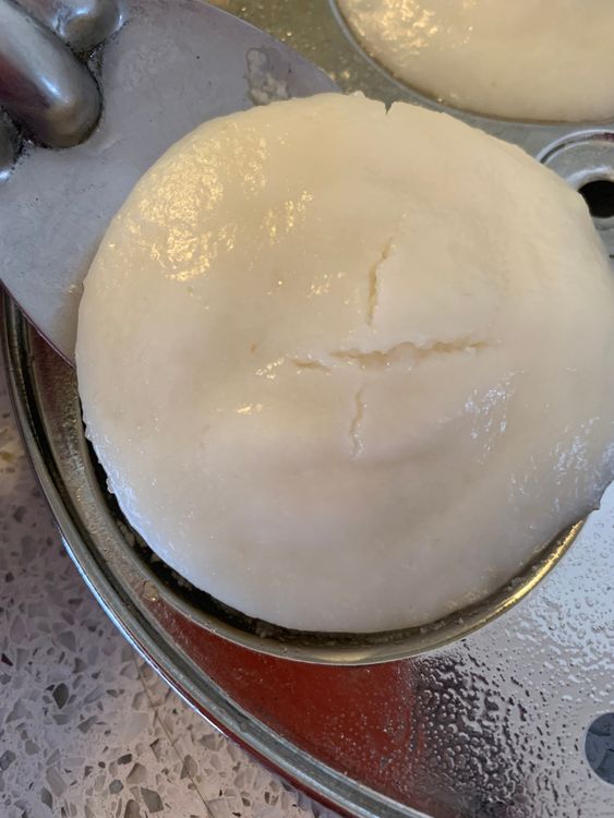 Step 1.1: Gently scoop the idlis from the moulds using a knife/ladle, taking care not to break them apart