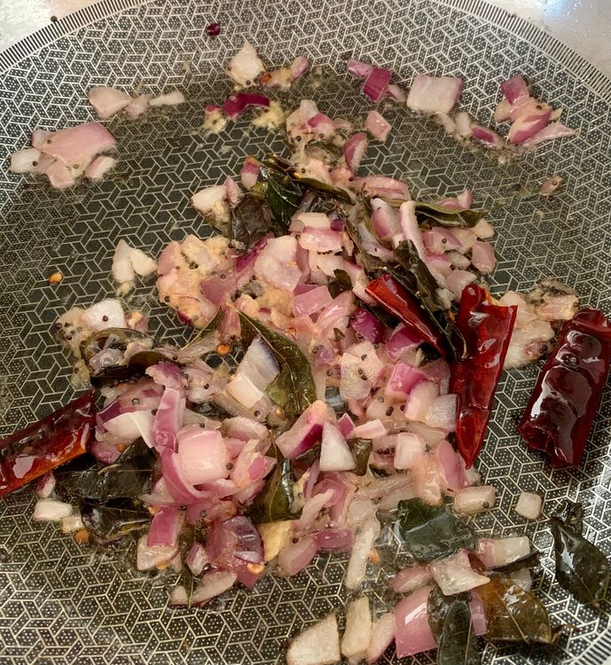Step 1.1: Add chopped onions and ginger garlic paste, and saute them until they become translucent and fragrant