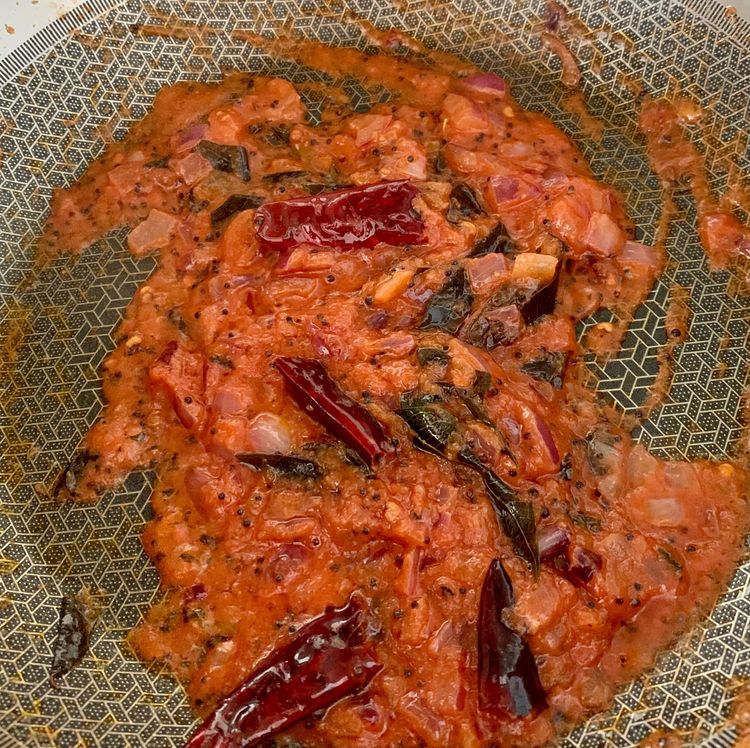 Step 1.1: Add chopped tomatoes and stir them in