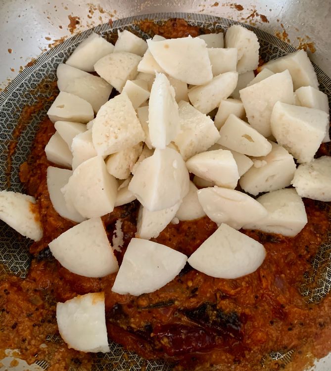 Step 1.1: Place the idli pieces into the pan and toss them with the masala