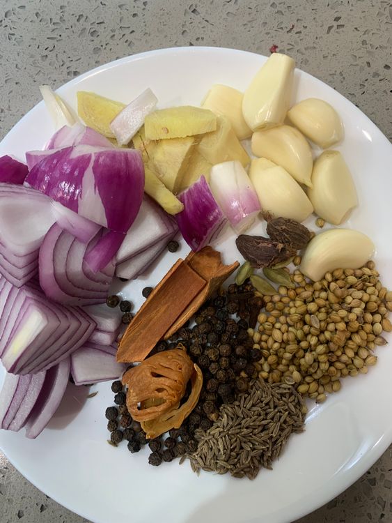 Step 2.1: In a large pot, combine chicken, garlic, ginger, onion, cumin seeds, coriander seeds, green cardamoms, black cardamoms, cinnamon sticks, cloves, mace flower, black peppercorns, lemon juice, salt, and water