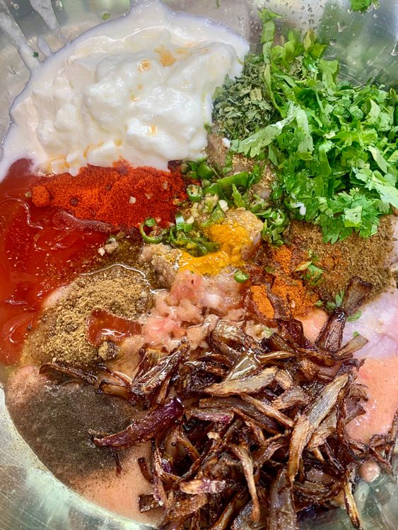 Step 3.1: In a large mixing bowl, add the chicken and all the ingredients listed under 'For Marination,' including the oil from the fried onions